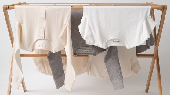 merz b. schwanen clothes air drying and hanging on a rack