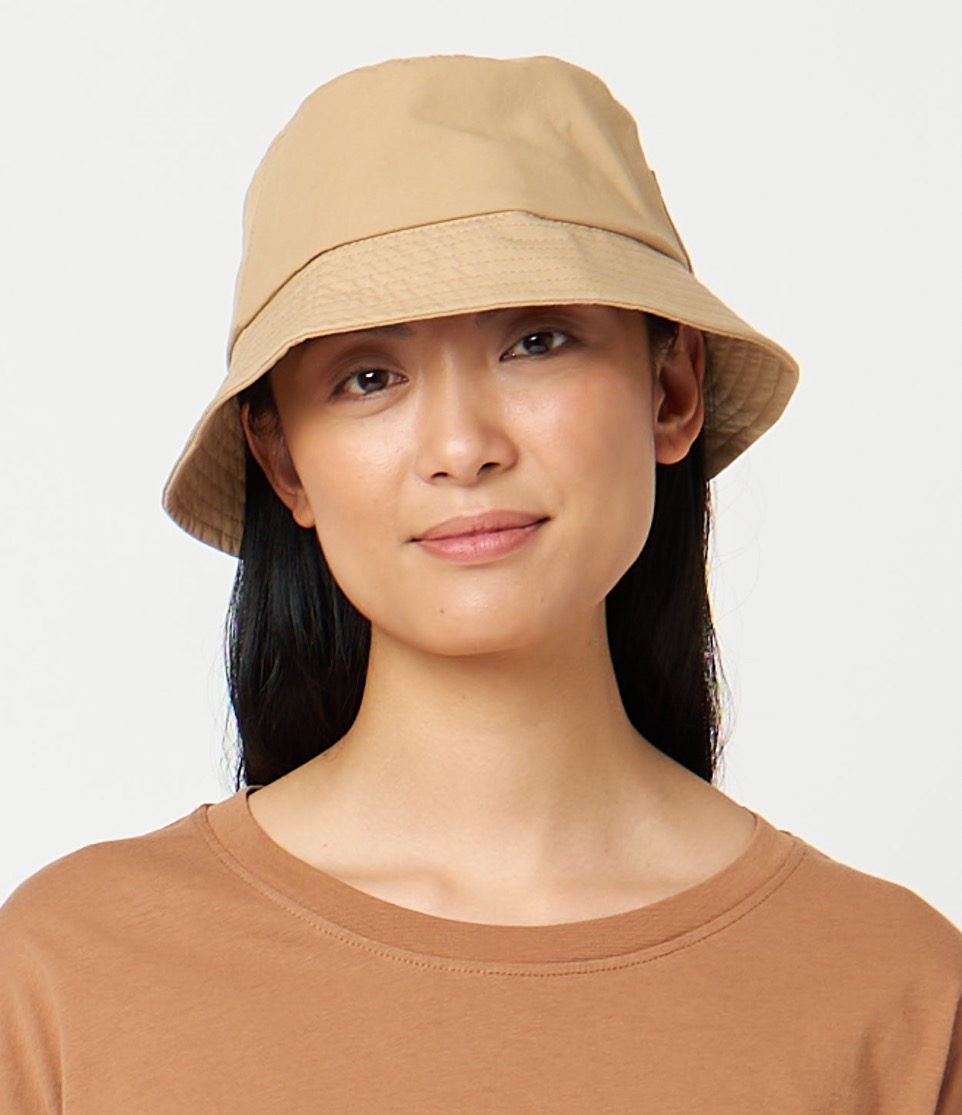 woman wearing bucket hat