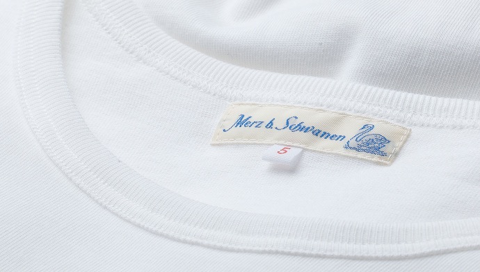 neckline and merz b. schwanen neck label of white t-shirt