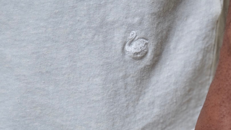 detail shot of swan embroidery on white t-shirt