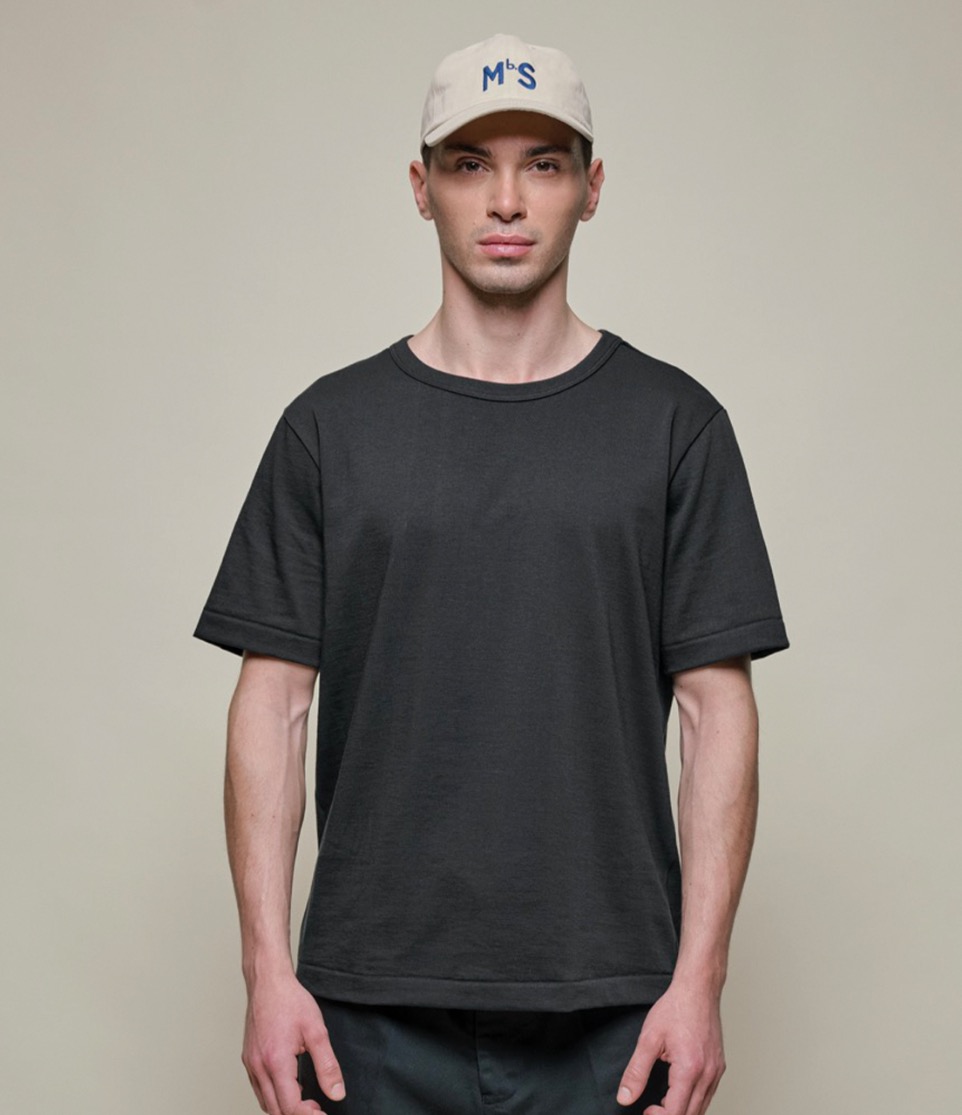 man wearing the 214 t-shirt in charcoal and cap