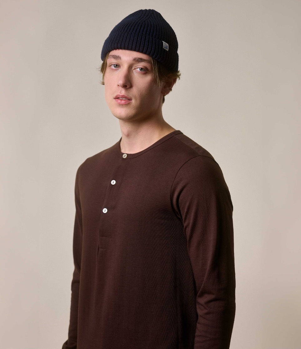 man wearing henley in brown