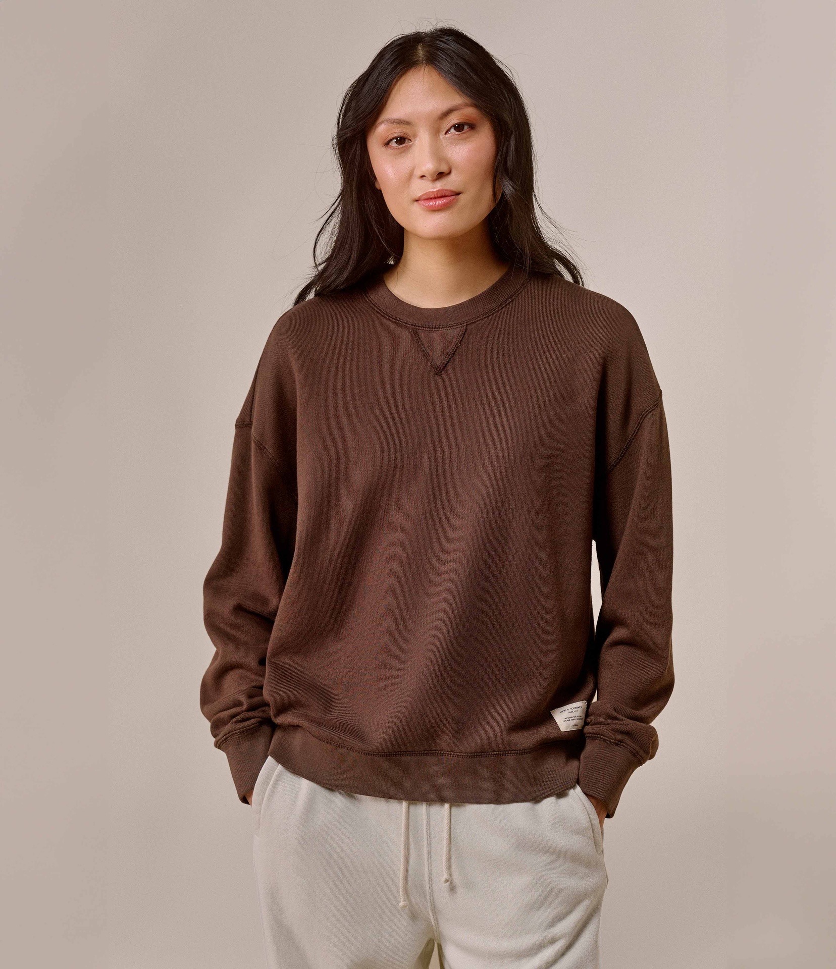 woman wearing brown sweatshirt