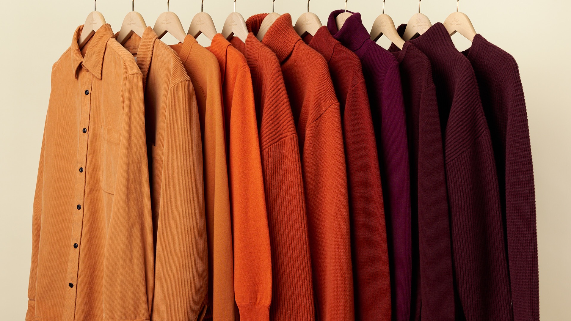 a range of knitwear styles hanging on a rack