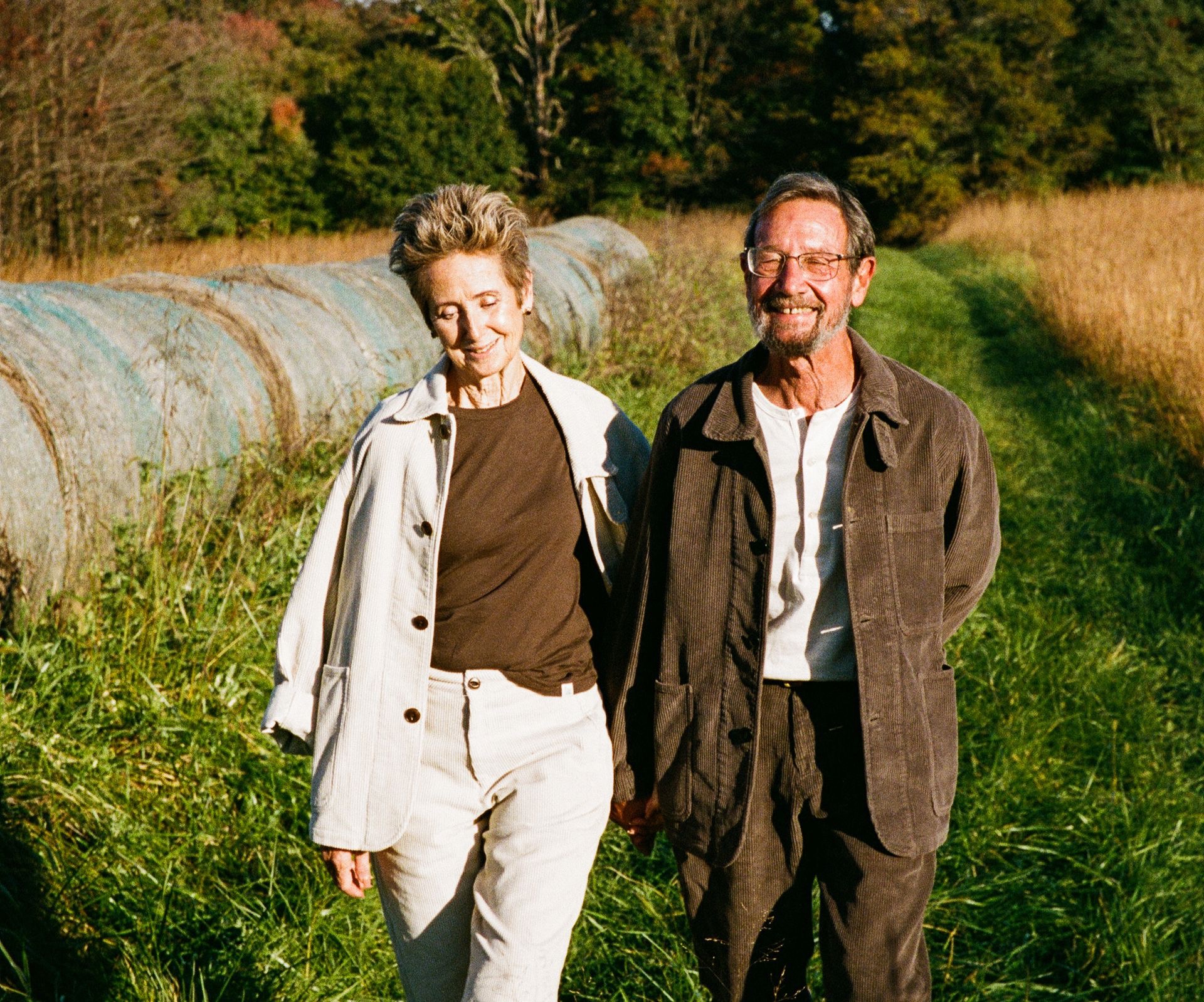 couple wearing corduroy ensemble in the color nature and brown