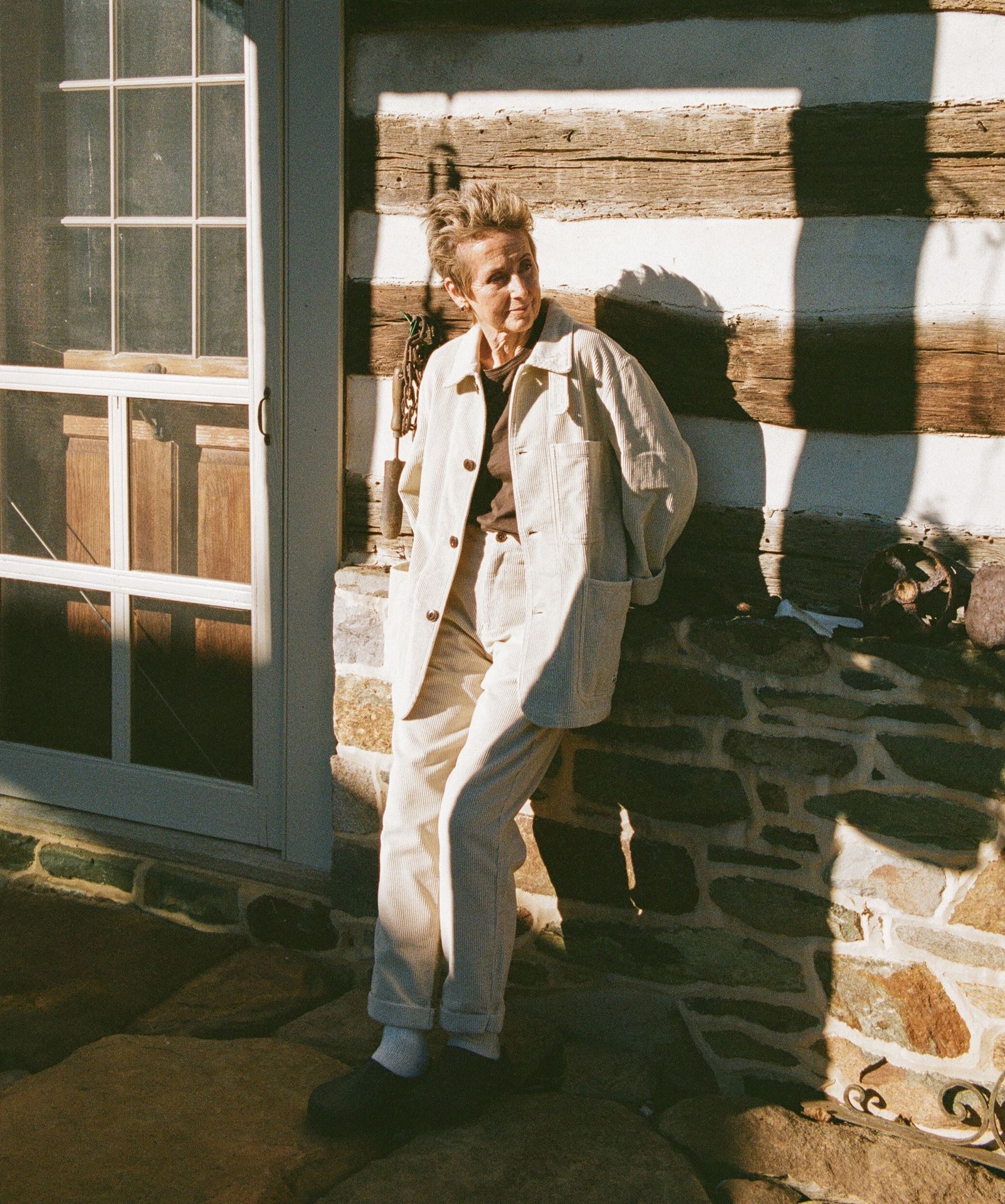 woman wearing corduroy jacket and pants in color nature