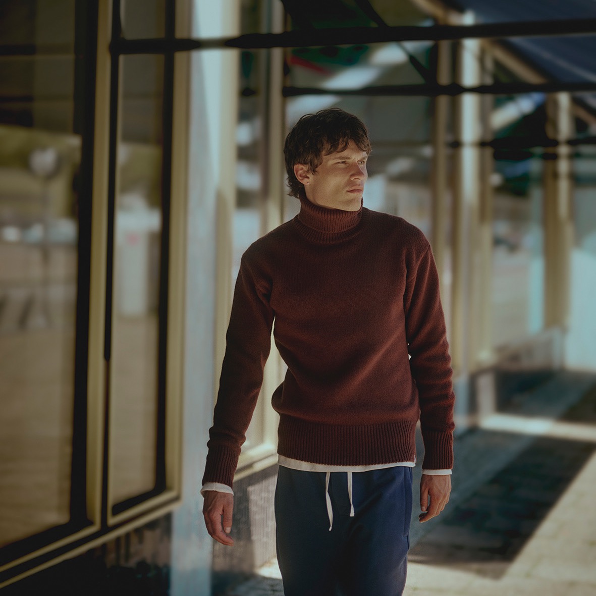 man wearing a brown turtleneck pullover