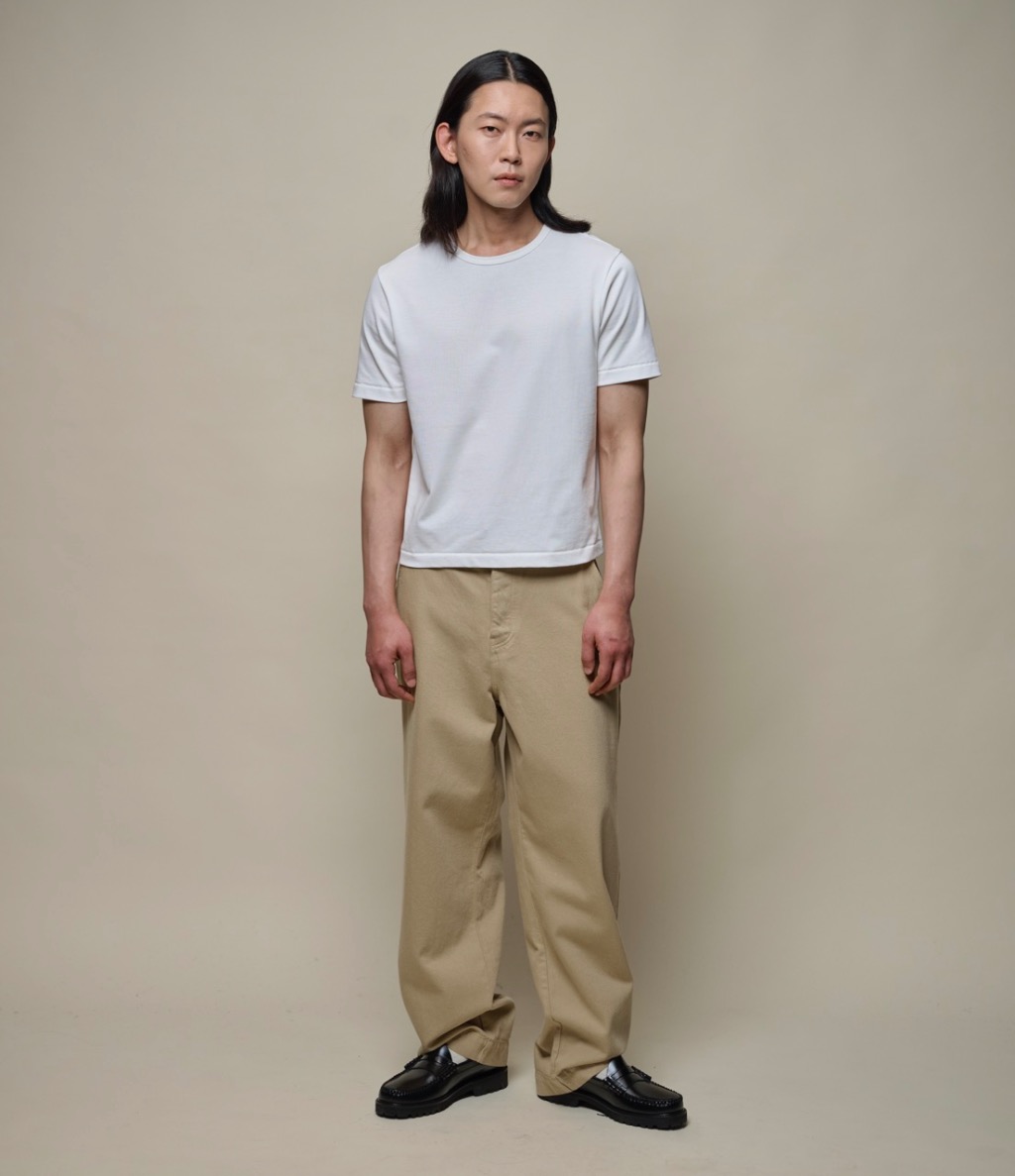 man wearing white t-shirt and twill pants in khaki