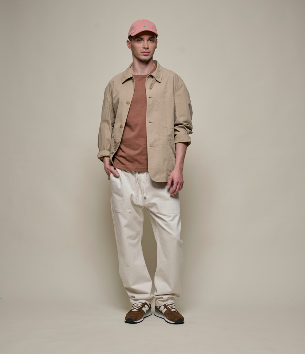 man wearing poplin jacket in khaki and twill pants in nature