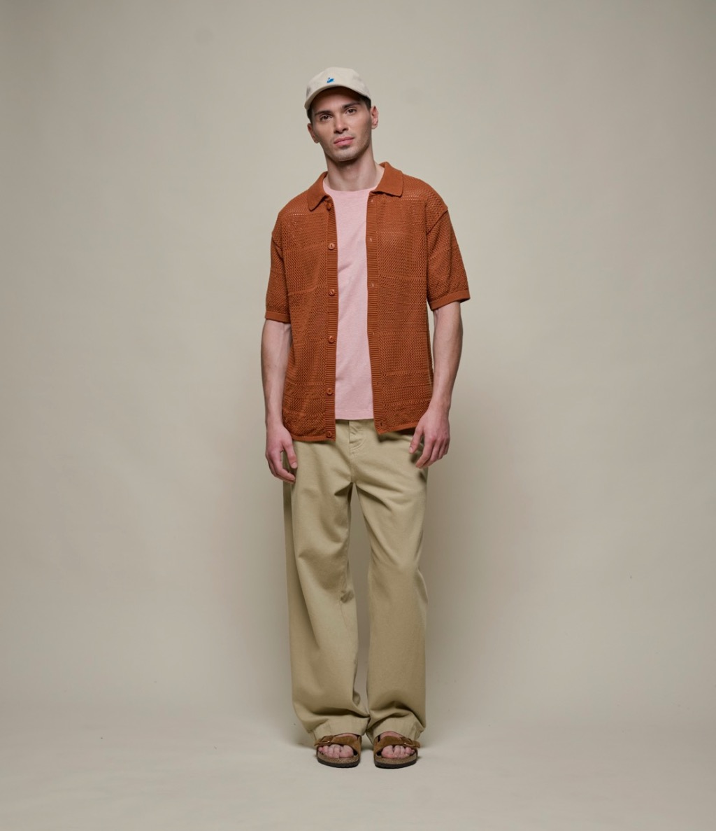 man wearing knitted shirt in brown and pants in khaki