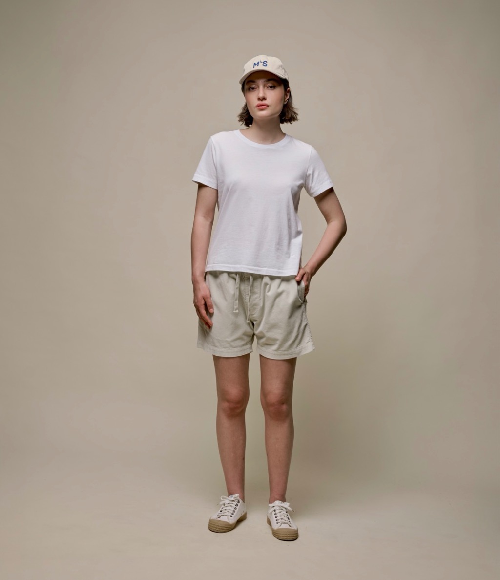 man wearing white T-shirt and corduroy shorts